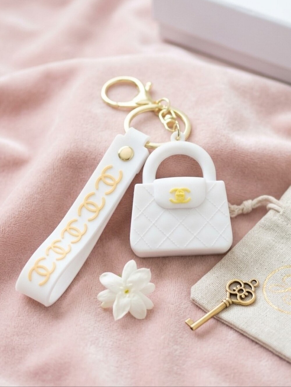 White Quilted Mini Handbag Keychain with Gold Accents